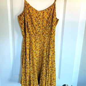 Spaghetti strap yellow floral sundress with elastic back.